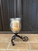Full view of hurricane candle holder with candle
