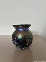 Full front view of vase showing iridescent finish and mosaic spots