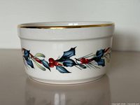 side view showing holly motif and gold rim