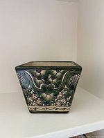front of square Talavera planter showing painted design