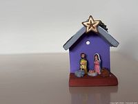 Front view showing figures, star, colours