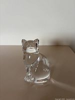 Front view of clear glass sitting cat figurine