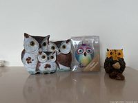 Group shot showing all three owl items
