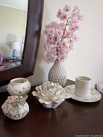All six ceramic and decorative items on dresser