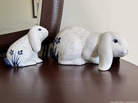 Both rabbit sculptures side by side showing sizes and overall design