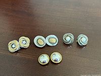 All four pairs of earrings displayed