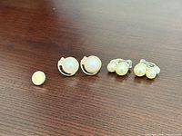 All earrings laid out on table