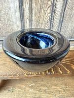 Top and side view of the blue swirl Kosta Boda Atoll tealight holder
