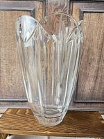 Front view of crystal vase showing overall shape and cut panel design