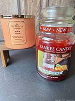 Yankee Candle Kitchen Spice large red wax jar and White Barn Peach Bellini peach frosted tumbler