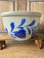 Full view of stoneware crock showing shape and decoration