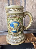 Front view showing Schlitz globe logo and decorative motifs