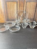 group view of all Candlewick pieces including relish dish, berry bowls, shakers, creamer and sugar bowls