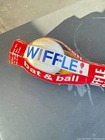 bat and ball secured by Wiffle branded paper sleeve