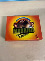 Front of slipcase showing artwork and corner damage