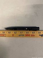 Full view of LED light alongside ruler showing ~5.75 in. length