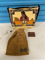 All three items front view: shoulder bag front graphic, onion bag, coin purse