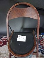 Front view of folding chair showing seat and backrest