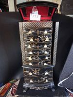 Full front view of armoire with lid open showing red interior