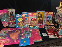Overall lot showing boxed Barbies, outfit packs and loose dolls