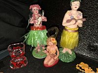 Group showing figurines, shot glass, bottle opener
