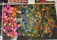 Wide view of plastic curtain components spread out with measuring tape