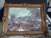 Front view of framed print with ornate gold frame