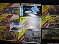 Overall view of all ten boxed kits laid out, showing brands and artwork