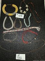 Group shot showing all necklaces and bracelets laid out
