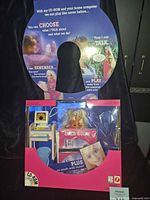 Front of opened original box displaying Barbie doll, CD-ROM shaped header