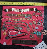 Full lot overview on red cloth under tape measure