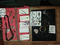 overview of all jewelry laid out on two cloths, approx. 30 pieces visible