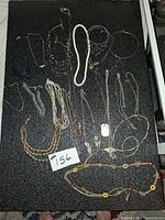 Overview of all jewellery pieces laid out on table