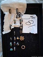 Tray displaying all rings in lot