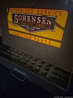 Front view showing Sorensen advertising panel and drop-down door