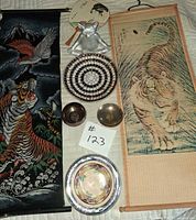All items laid out showing both scrolls, tray, bowls, serving dish, cat figurine and fan