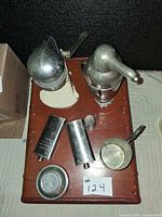 Top view of all seven barware items arranged on tray