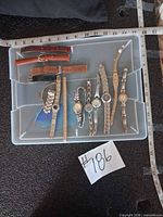 Overview of tray showing all watches, leather straps and metal bands