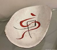 Top view of white interior with red and black abstract design