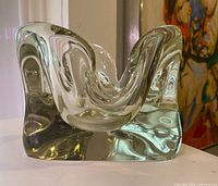 Front view showing fluid wave form and thick clear glass