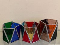 Group view of all four stained glass candle holders