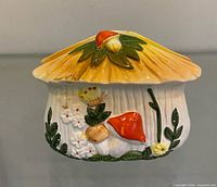 Front view showing mushroom design, glaze colors, overall form