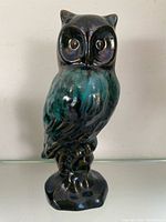 Front view of glazed ceramic owl figurine