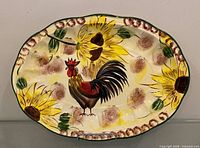 Full view of oval platter showing rooster and sunflower design