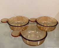 Three Corning Vision amber Grab-It bowls side-by-side