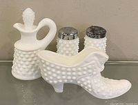 Front view of all four milk glass pieces