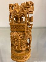 right side view highlighting carved patterns and structure