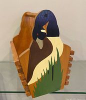 Angled view showing painted mallard, slatted side construction and carry handle