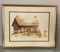 Full view of framed watercolour painting showing cottage scene