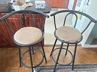 Front view of both metal bar stools